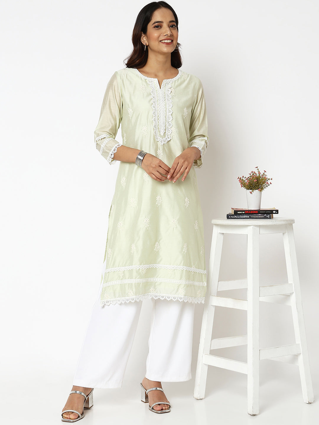 Women Wearing Straight Fit Embroidered Kurta